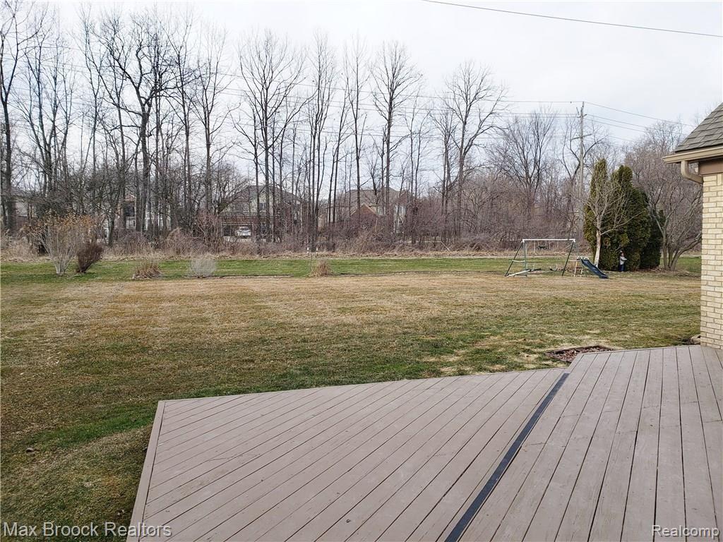469 Lexington Drive Rochester, MI 48307 - Photo 9 of 17 Large yard backing to open area...view from 2 level deck