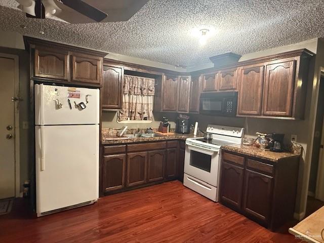 1507 Guerra Avenue Roma, TX 78584 - Photo 6 of 15 a kitchen with stainless steel appliances granite countertop a refrigerator stove a sink and dishwasher with wooden floor