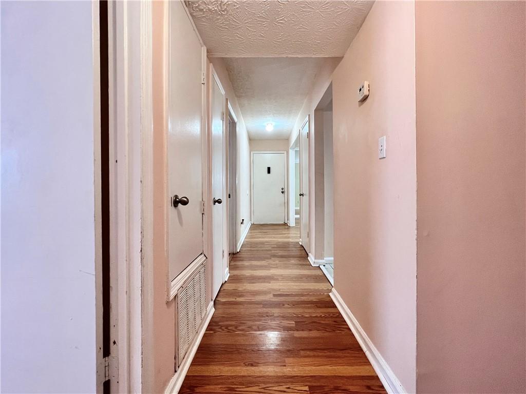 a view of a hallway with the wooden floor