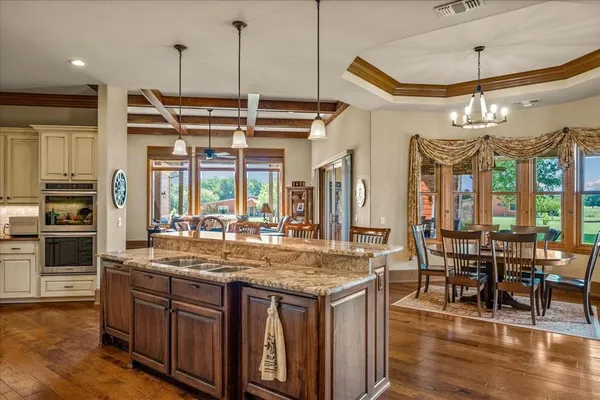 a kitchen with stainless steel appliances granite countertop a stove and refrigerator