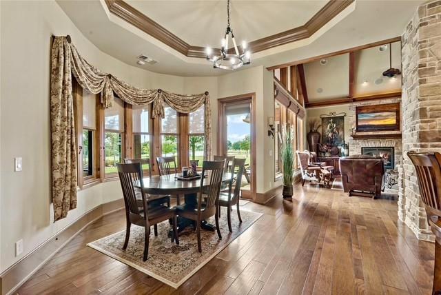 695 County Rd Road Honey Grove, TX 75446 - Photo 13 of 40 a view of a dining room with furniture window and wooden floor