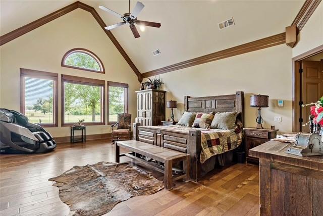 695 County Rd Road Honey Grove, TX 75446 - Photo 16 of 40 a spacious bedroom with a bed a couch and dresser
