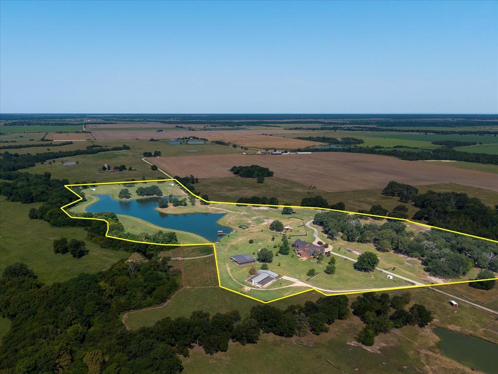 695 County Rd Road Honey Grove, TX 75446 - Photo 2 of 40 an aerial view of a house with a ocean view