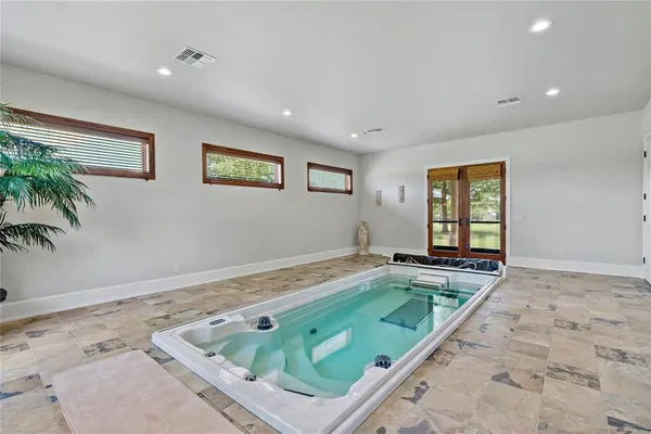 a view of a room with window and wooden floor