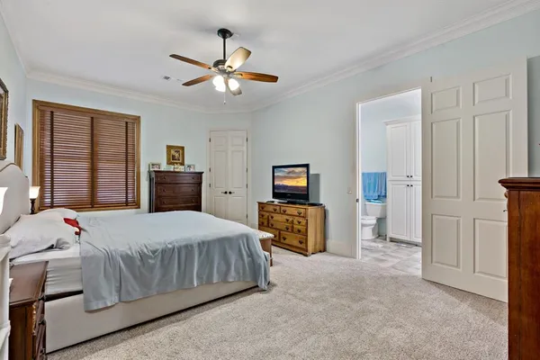 a bedroom with a bed and dresser