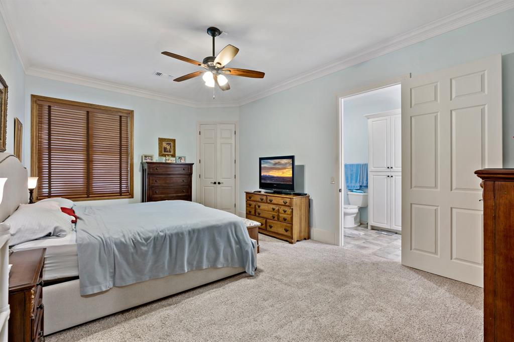 695 County Rd Road Honey Grove, TX 75446 - Photo 28 of 40 a bedroom with a bed and dresser