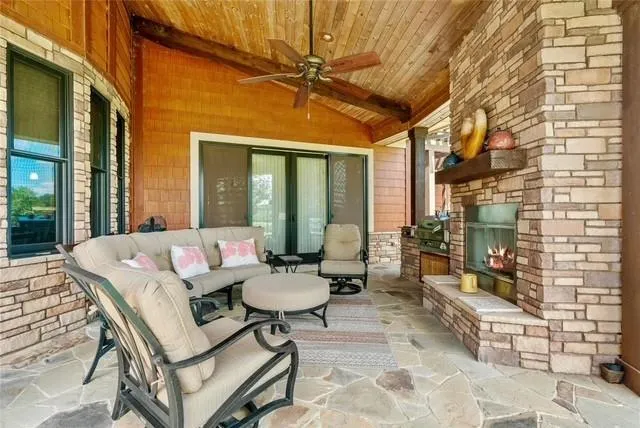 a balcony with furniture and a potted plant