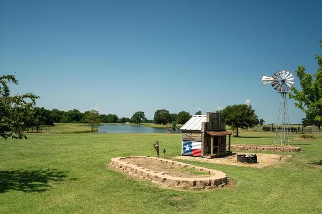 a house view with swimming pool and outdoor space
