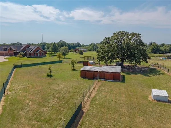 a view of a lake with couches in the patio