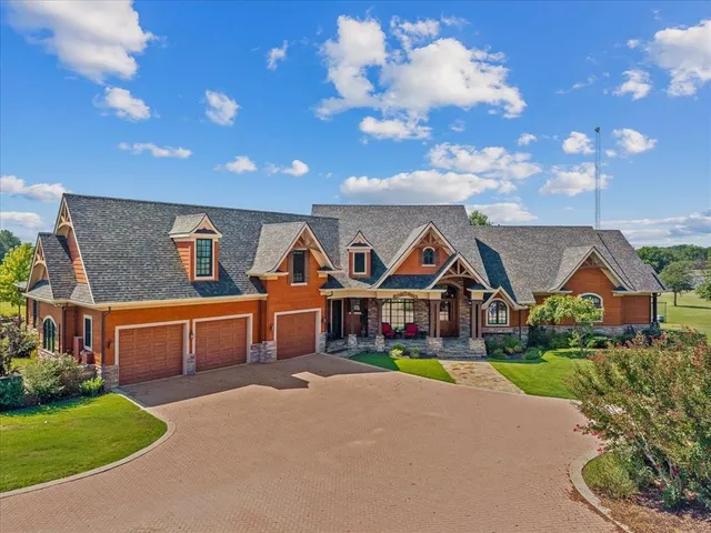 a front view of house with yard outdoor seating and green space