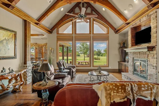 a living room with fireplace furniture and a flat screen tv