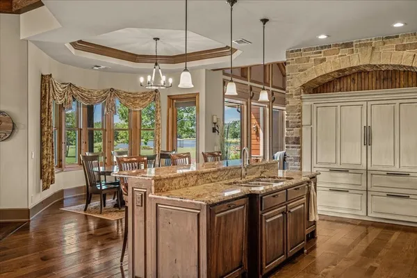 a kitchen with stainless steel appliances granite countertop a stove and a refrigerator