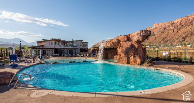 2331 Mesa Road, Unit E3 Moab, UT 84532 - Photo 48 of 71 Community pool featuring a mountain view, a patio, a balcony, and a jacuzzi