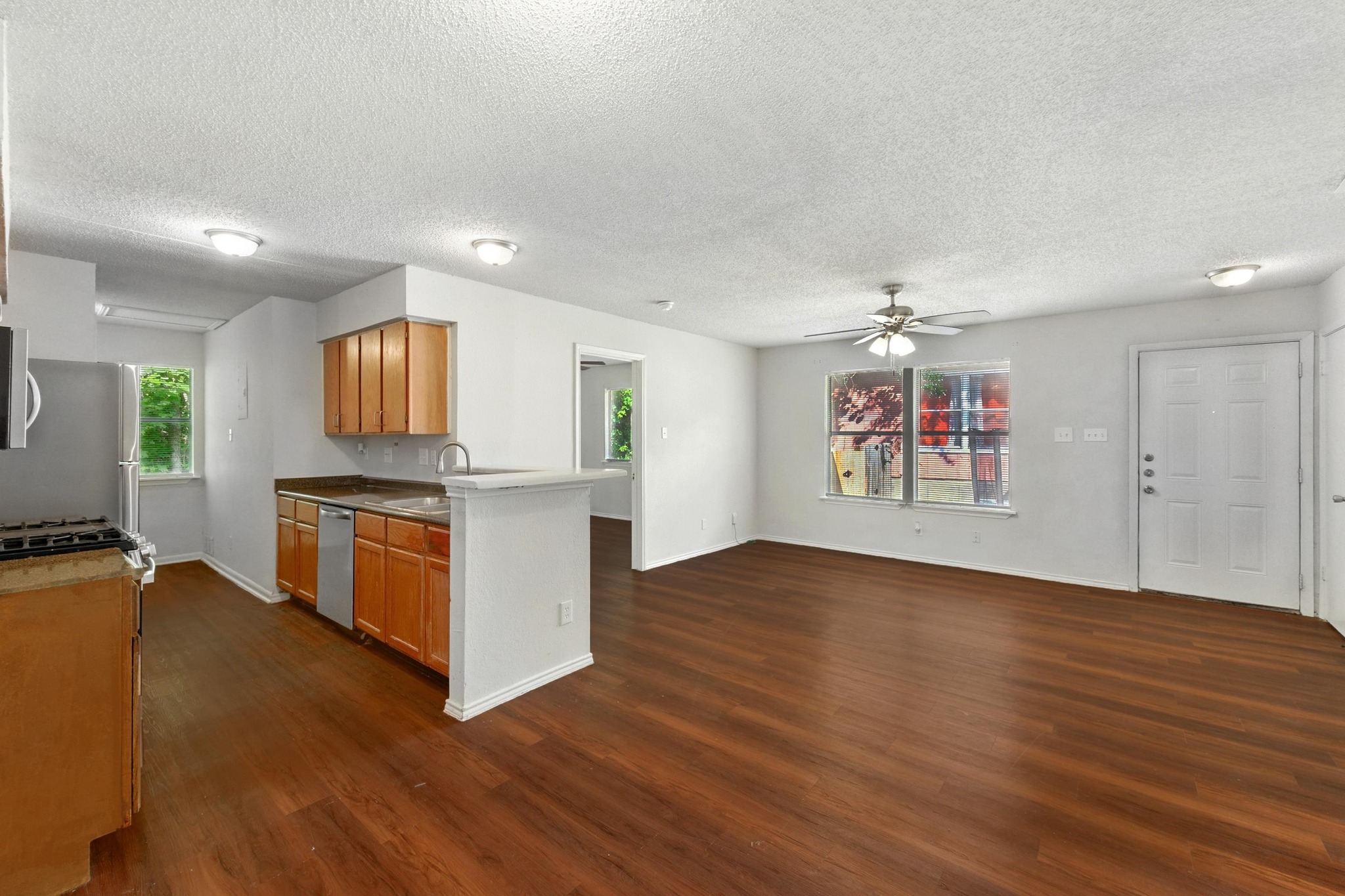 5707 Spring Meadow Road Austin, TX 78744 - Photo 10 of 21 a view of kitchen with microwave and stove