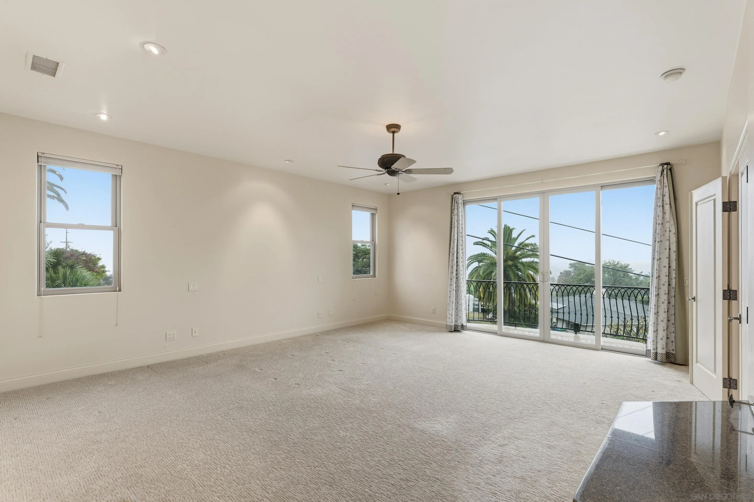11020 Explorer Road El Cajon, CA 92020 - Photo 11 of 29 a view of a big room with windows and chandelier fan