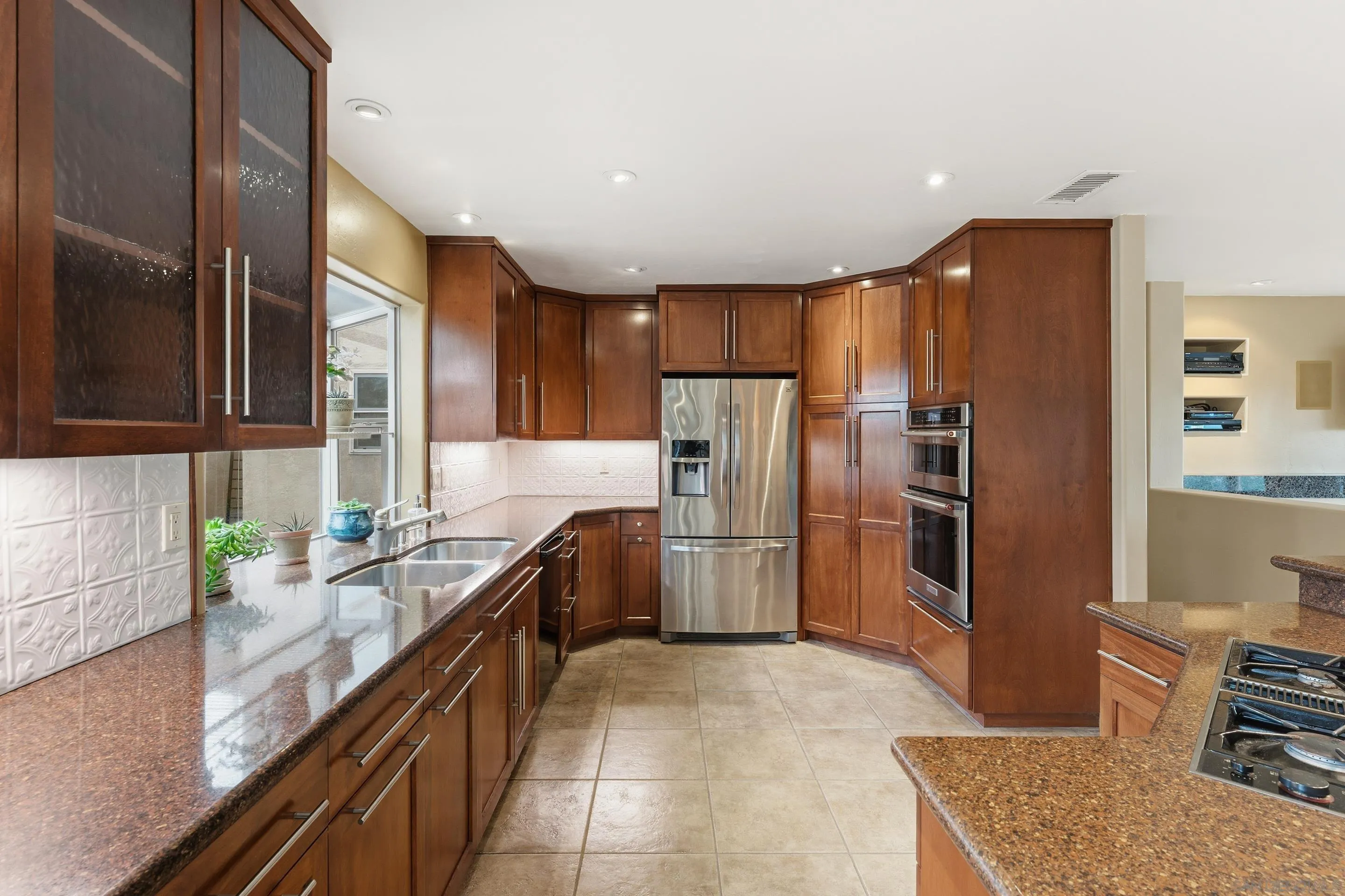 11020 Explorer Road El Cajon, CA 92020 - Photo 15 of 29 a kitchen with refrigerator and cabinets
