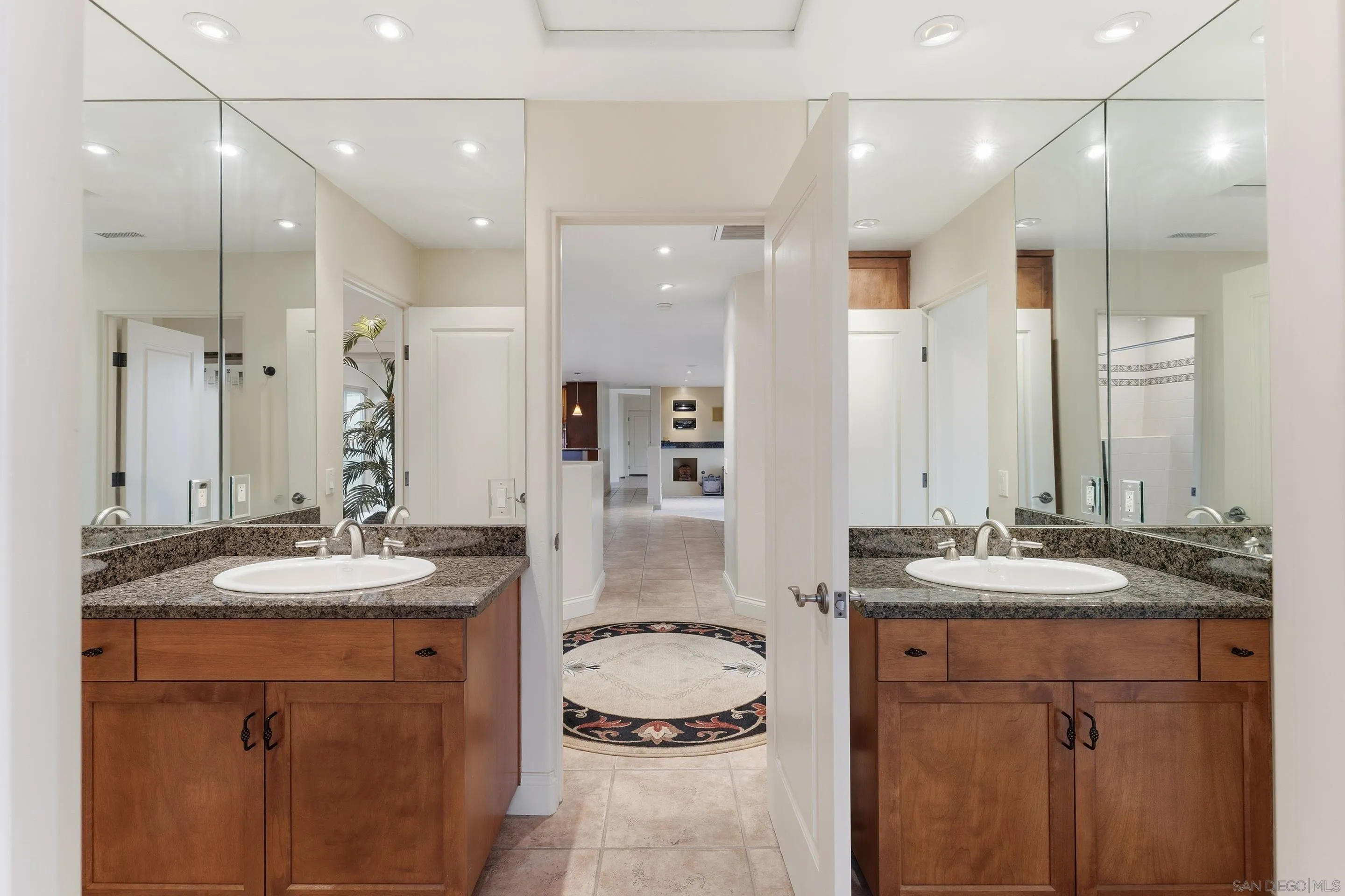 11020 Explorer Road El Cajon, CA 92020 - Photo 19 of 29 a bathroom with a granite countertop sink and a mirror