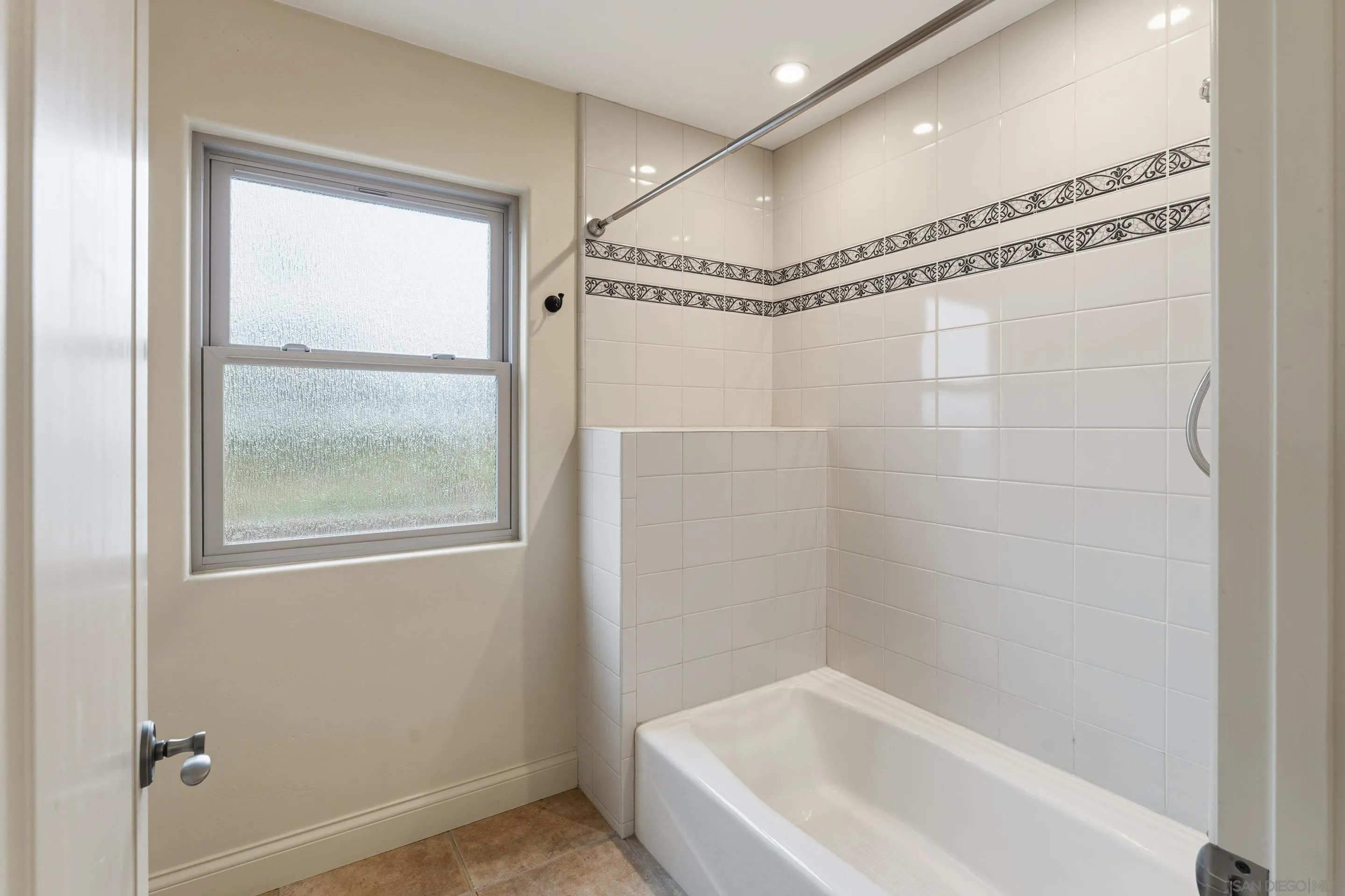 11020 Explorer Road El Cajon, CA 92020 - Photo 20 of 29 a bathroom with a bathtub and a shower