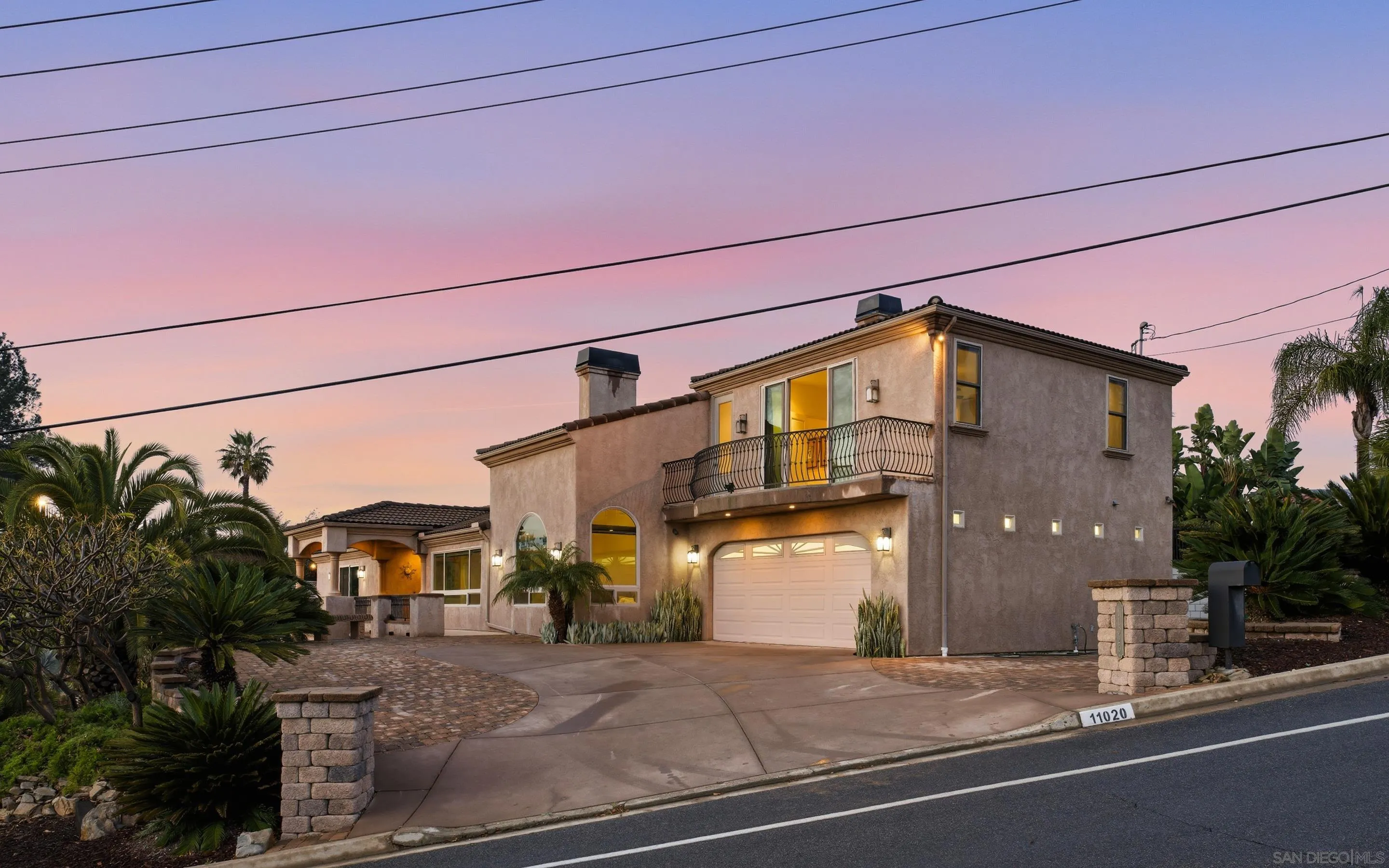 11020 Explorer Road El Cajon, CA 92020 - Photo 26 of 29 a front view of a house with a yard and garage