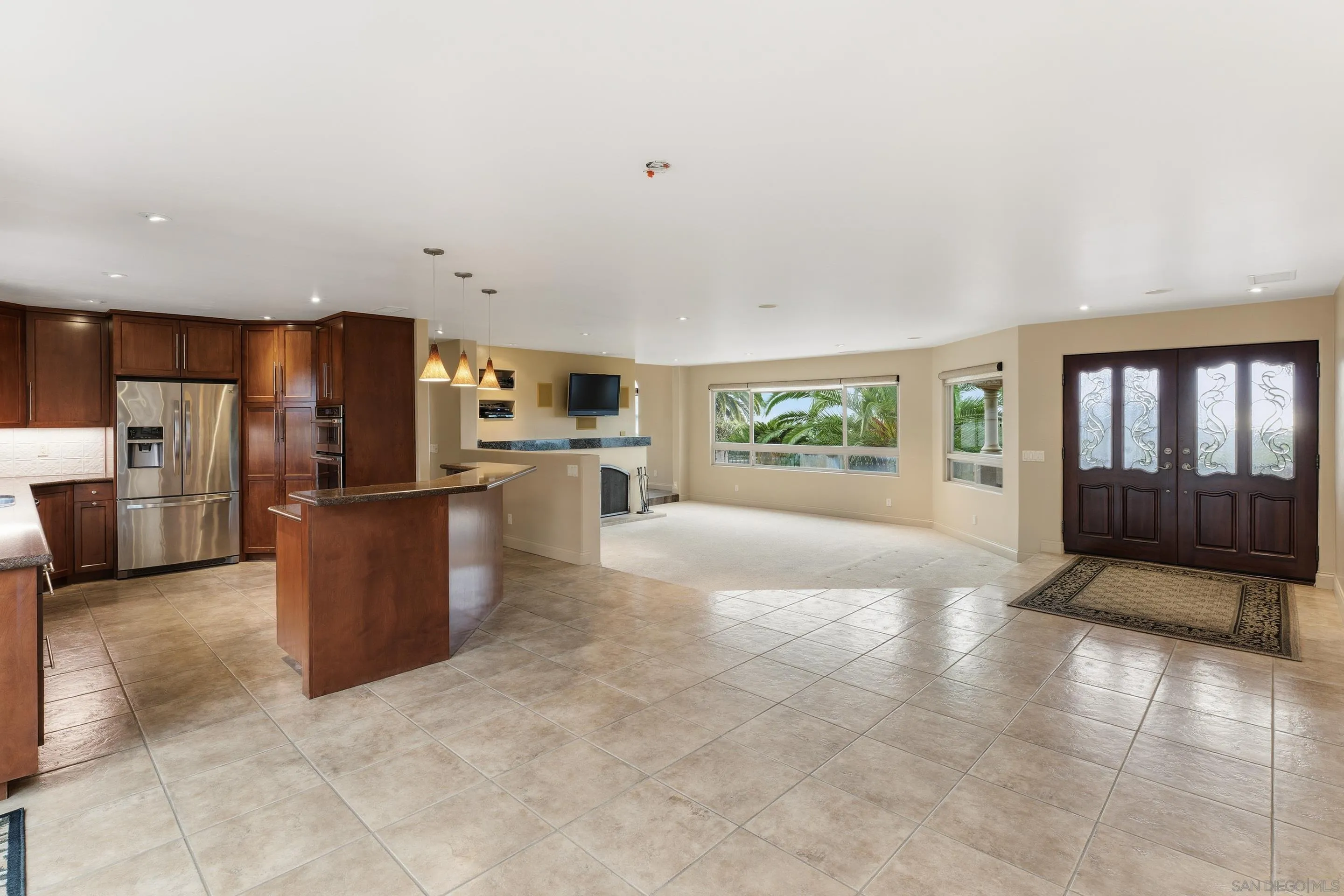 11020 Explorer Road El Cajon, CA 92020 - Photo 5 of 29 a large kitchen with stainless steel appliances kitchen island granite countertop a refrigerator and a stove top oven
