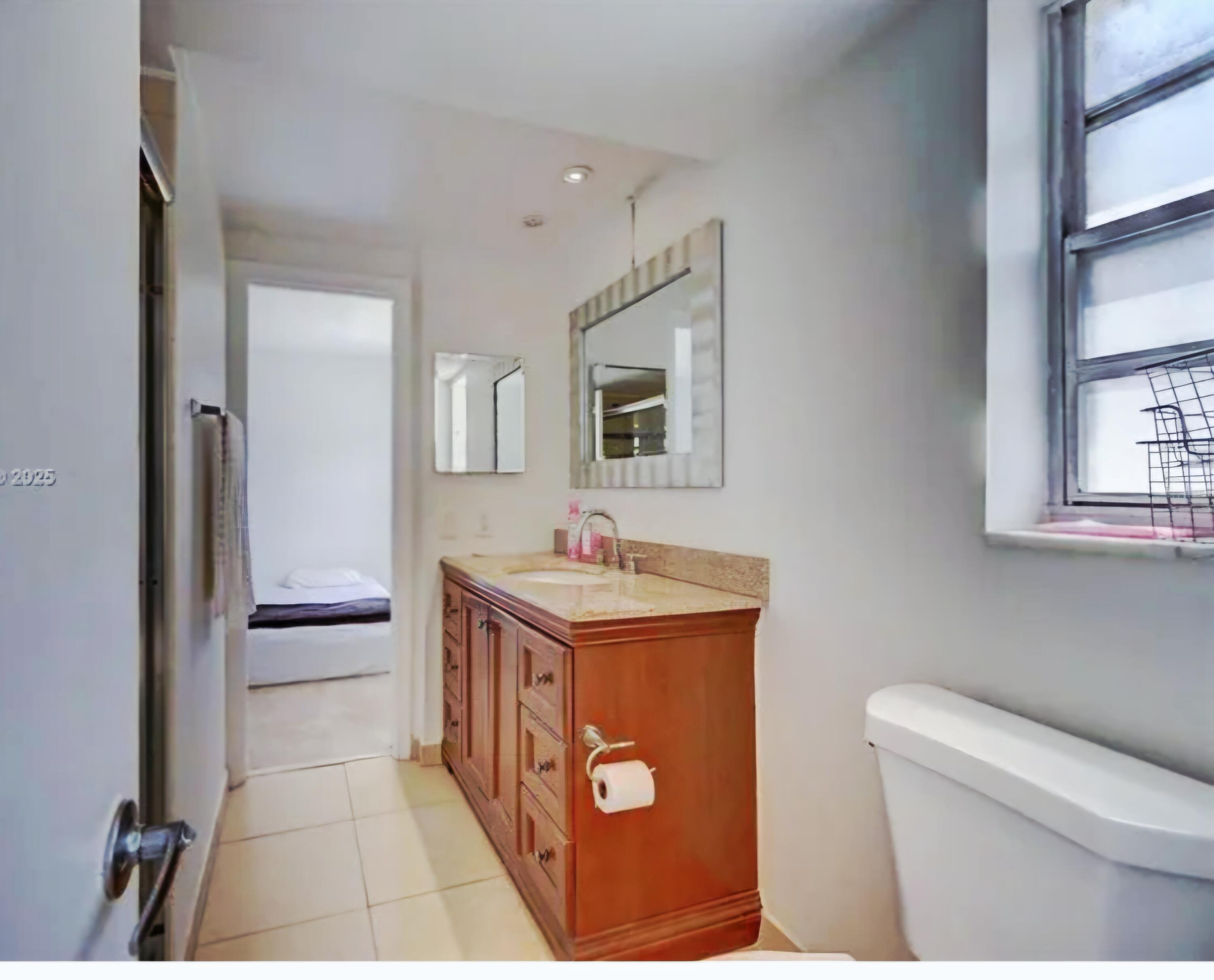 200 South Birch Road, Unit 208 Fort Lauderdale, FL 33316 - Photo 17 of 22 a kitchen with a stove and a refrigerator