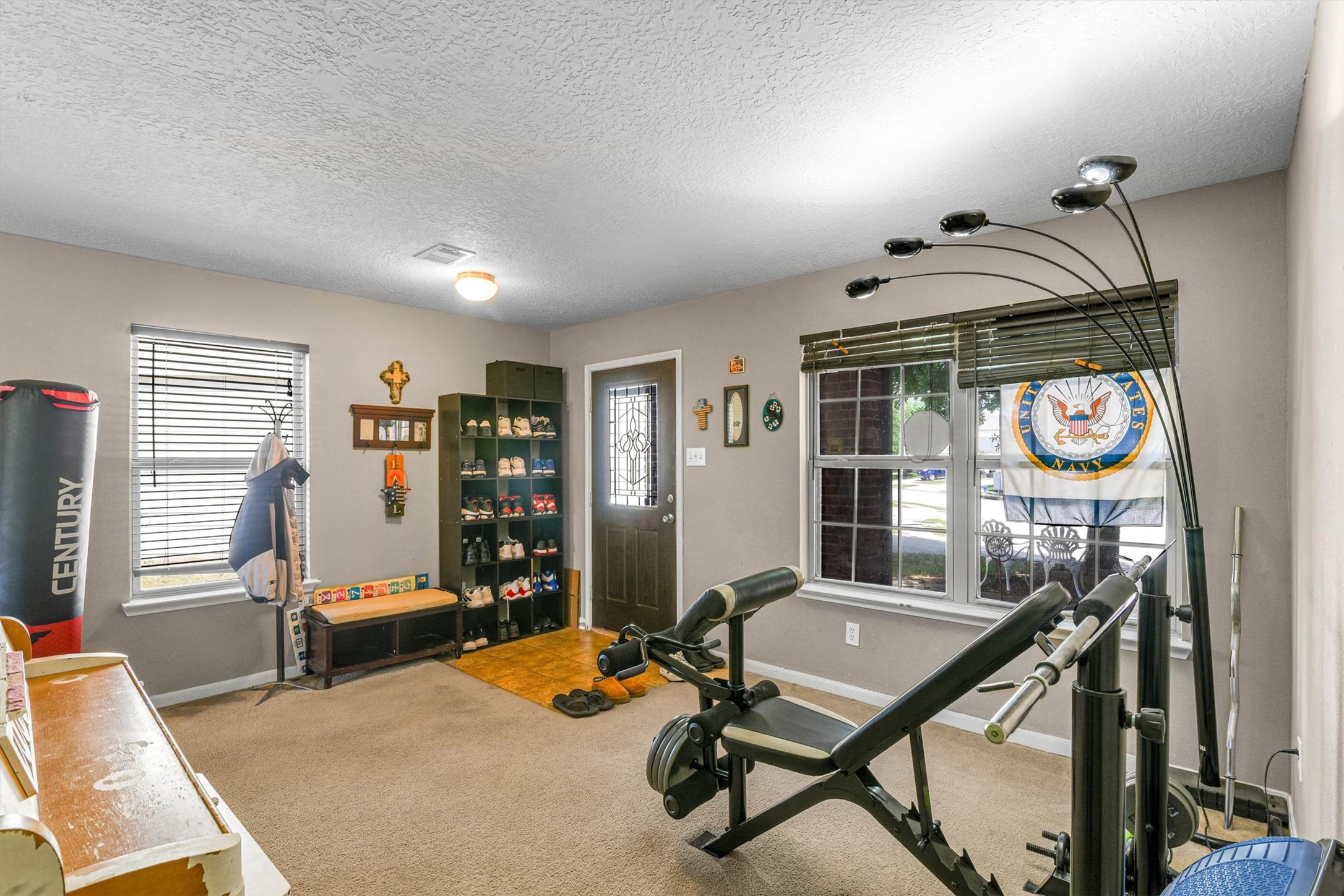 3003 Legends York Drive Spring, TX 77386 - Photo 6 of 29 a living room with furniture a window and gym equipment