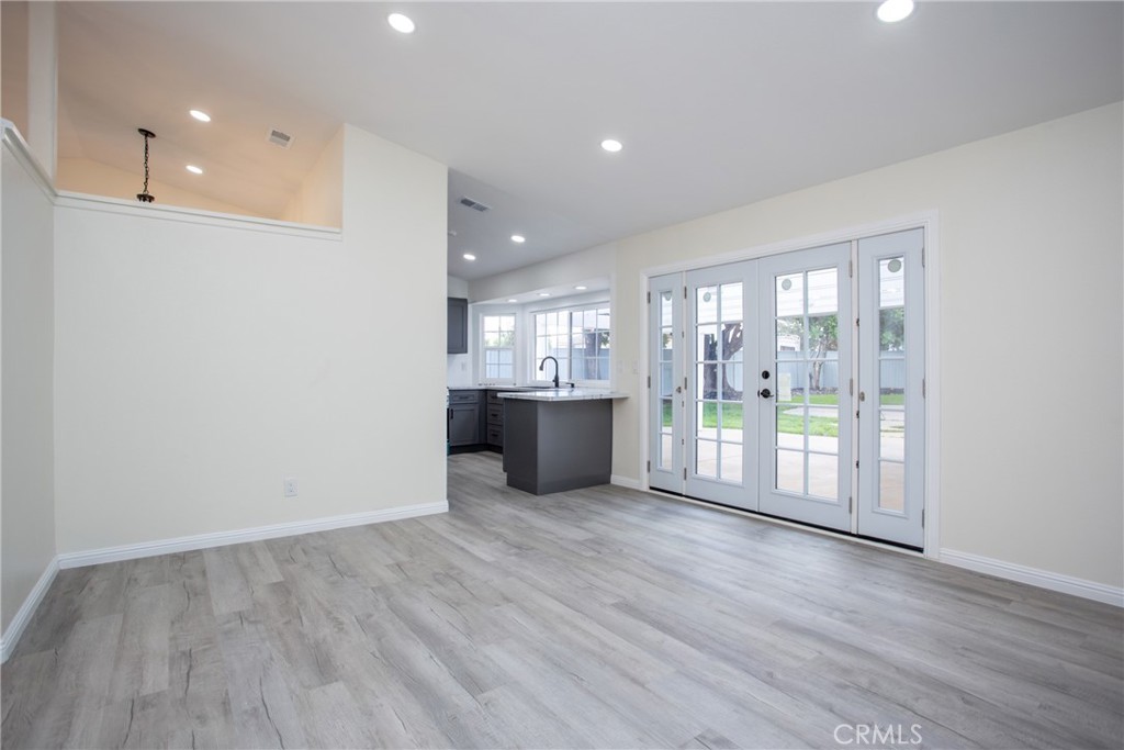 45800 Classic Way Temecula, CA 92592 - Photo 14 of 61 a view of an empty room with wooden floor and a window
