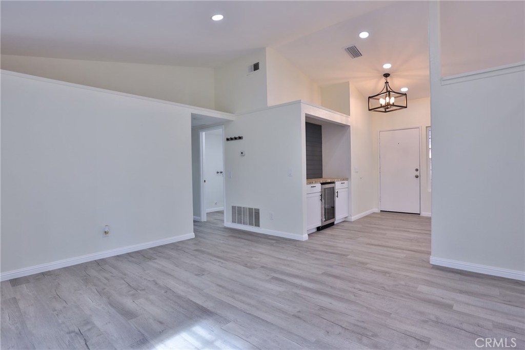 45800 Classic Way Temecula, CA 92592 - Photo 16 of 61 an empty room with wooden floor and windows