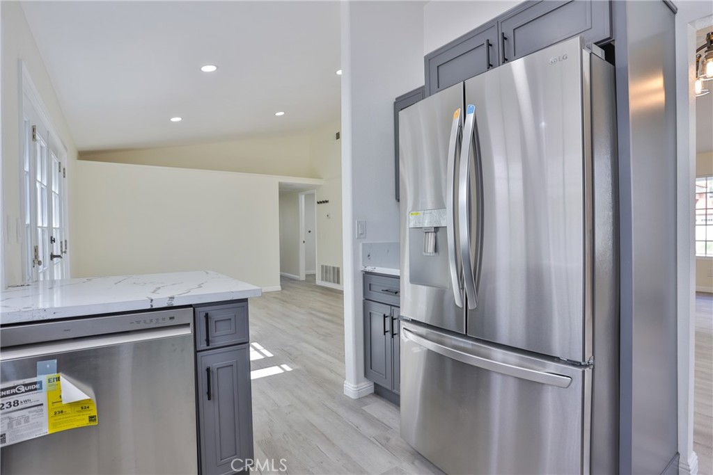 45800 Classic Way Temecula, CA 92592 - Photo 20 of 61 a kitchen with stainless steel appliances a refrigerator and a sink