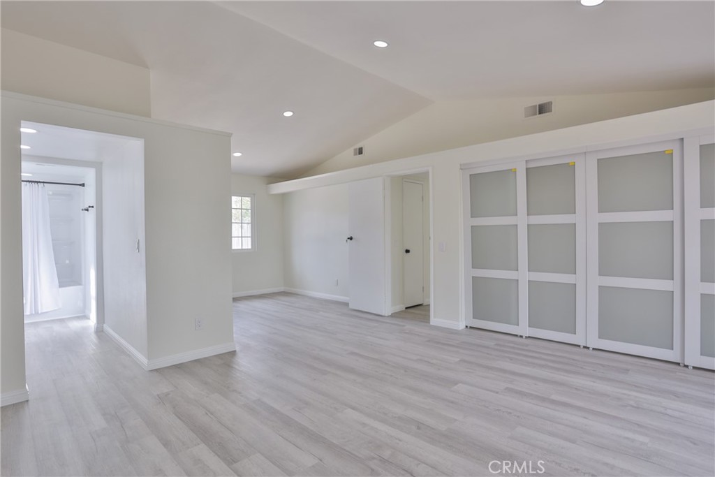 45800 Classic Way Temecula, CA 92592 - Photo 23 of 61 a view of an empty room with wooden floor and closet