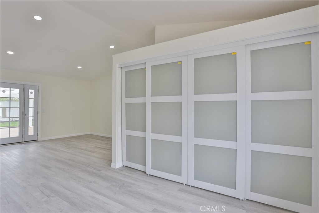 45800 Classic Way Temecula, CA 92592 - Photo 25 of 61 a view of an empty room with wooden floor and a window
