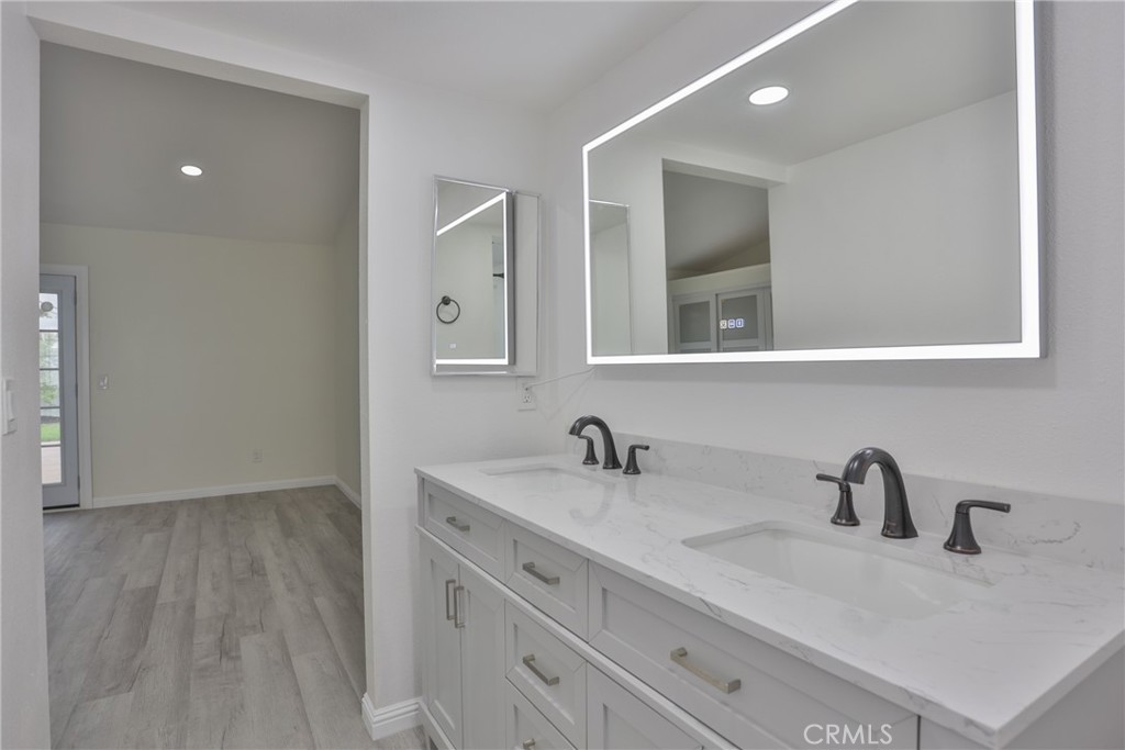 45800 Classic Way Temecula, CA 92592 - Photo 27 of 61 a bathroom with a sink and a mirror