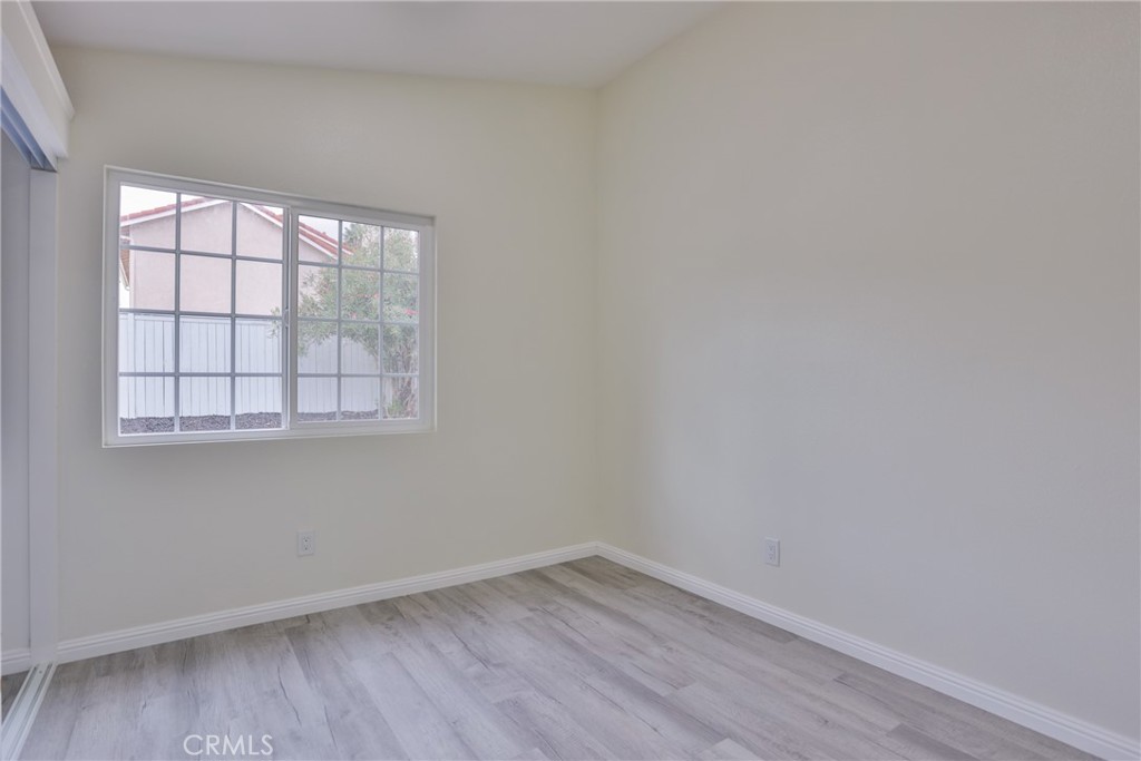 45800 Classic Way Temecula, CA 92592 - Photo 29 of 61 wooden floor in an empty room with a window
