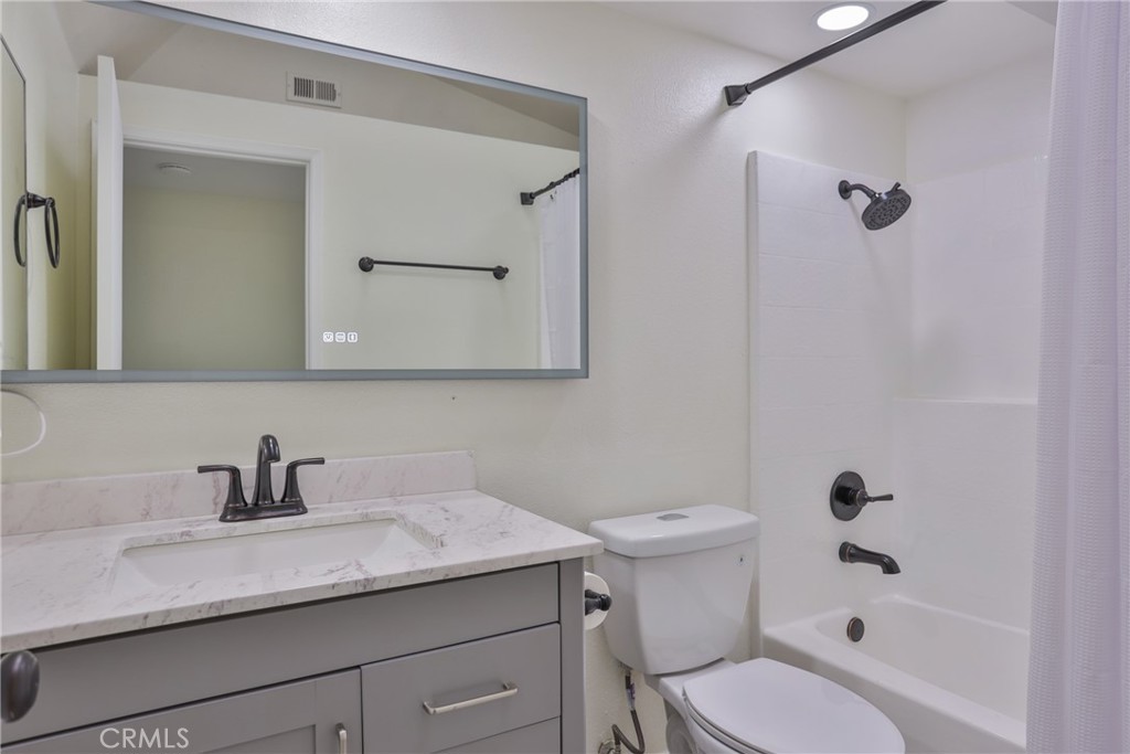 45800 Classic Way Temecula, CA 92592 - Photo 32 of 61 a bathroom with a sink a toilet and shower