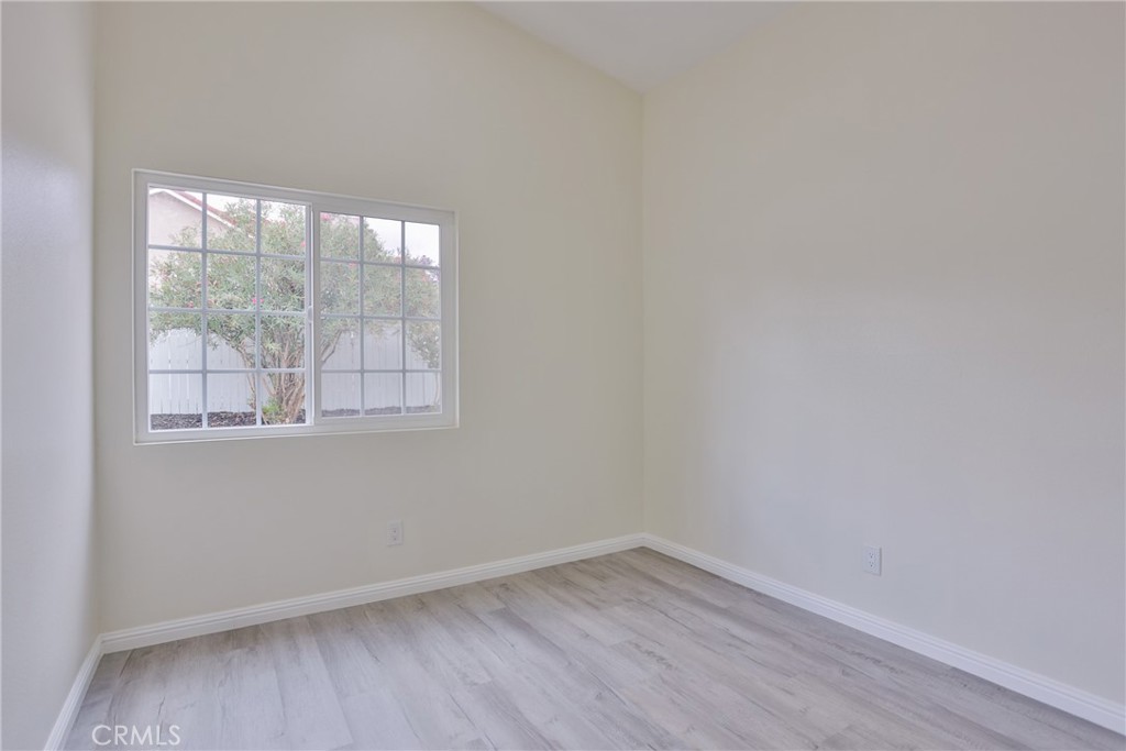 45800 Classic Way Temecula, CA 92592 - Photo 34 of 61 an empty room with wooden floor and windows