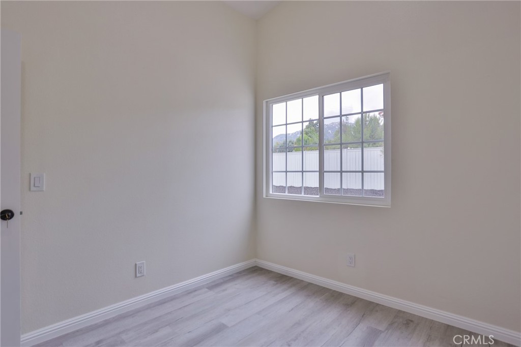 45800 Classic Way Temecula, CA 92592 - Photo 35 of 61 wooden floor in an empty room with a window