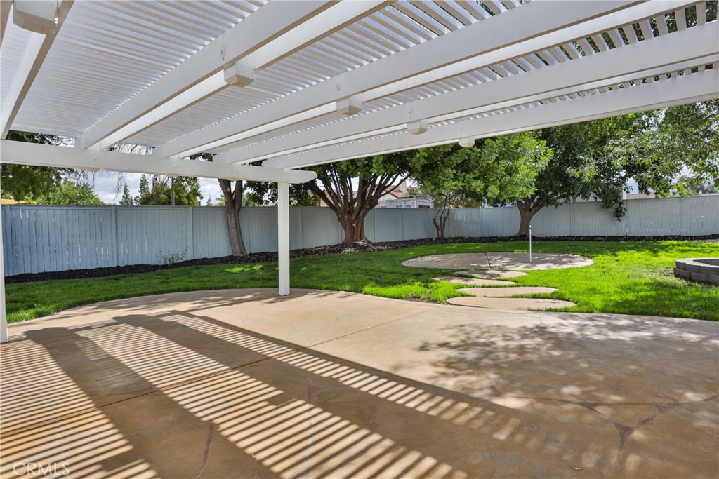 45800 Classic Way Temecula, CA 92592 - Photo 42 of 61 a view of a patio with a table and chairs under an umbrella