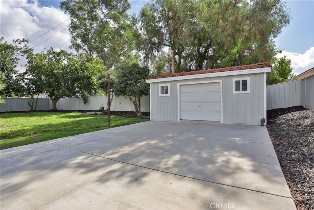 45800 Classic Way Temecula, CA 92592 - Photo 50 of 61 a view of a house with a yard and garage