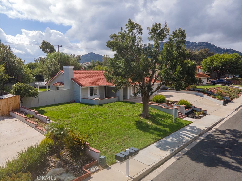 45800 Classic Way Temecula, CA 92592 - Photo 5 of 61 a front view of a house with garden