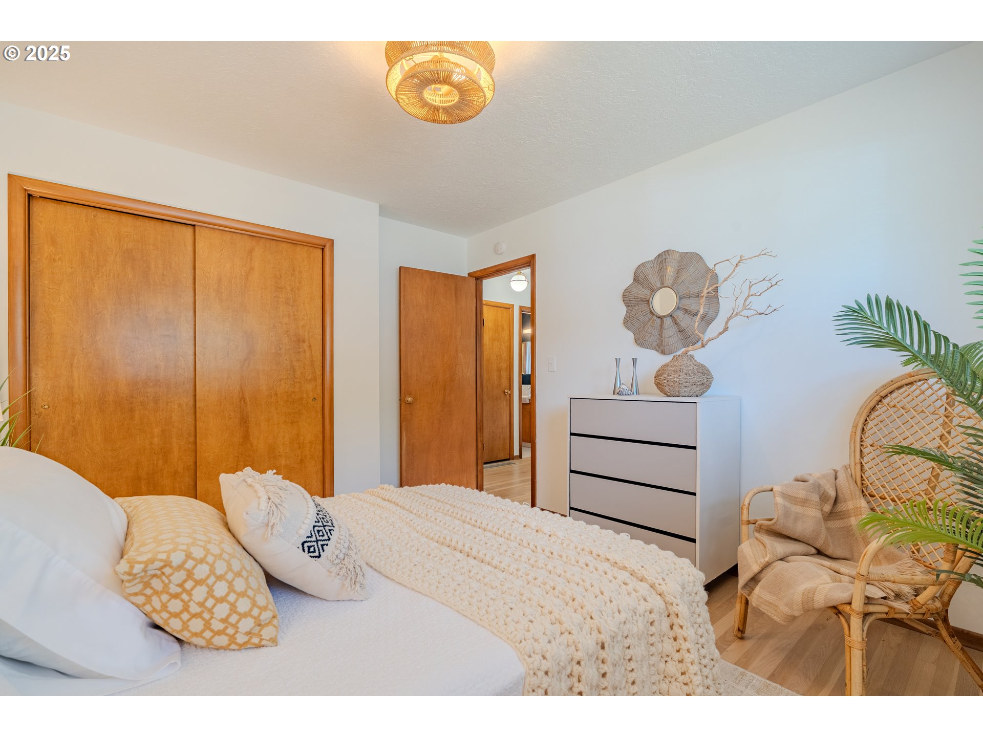 2146 Southeast 185th Avenue Gresham, OR 97233 - Photo 18 of 48 a bedroom with a bed and a chandelier