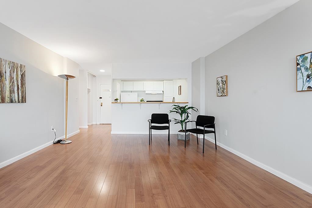 380 Mountain Road, Unit 907 Union City, NJ 07087 - Photo 12 of 25 a living room with furniture and a wooden floor
