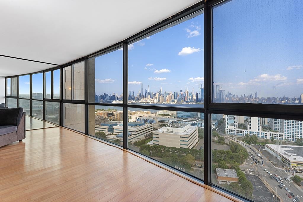 380 Mountain Road, Unit 907 Union City, NJ 07087 - Photo 2 of 25 a view of a floor to room with wooden floor