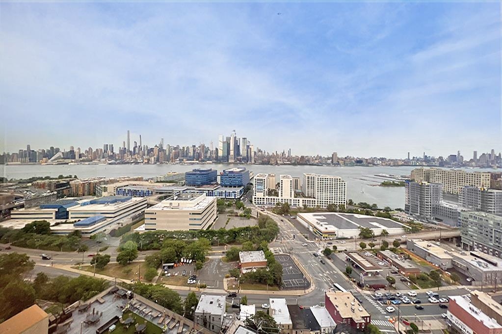 380 Mountain Road, Unit 907 Union City, NJ 07087 - Photo 3 of 25 a picture of city view with lake view and boat