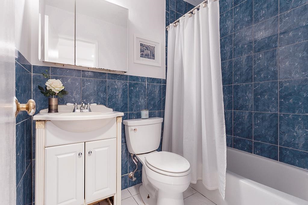 380 Mountain Road, Unit 907 Union City, NJ 07087 - Photo 9 of 25 a bathroom with a sink a toilet and shower