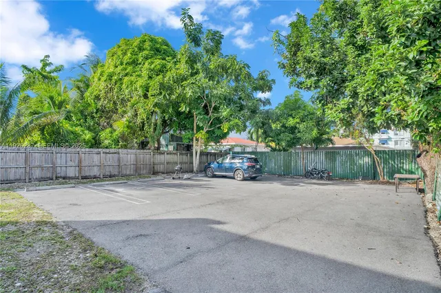 a view of a backyard and tree