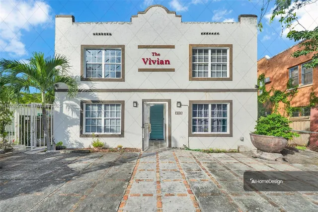 a view of a brick building with a bench in front of it
