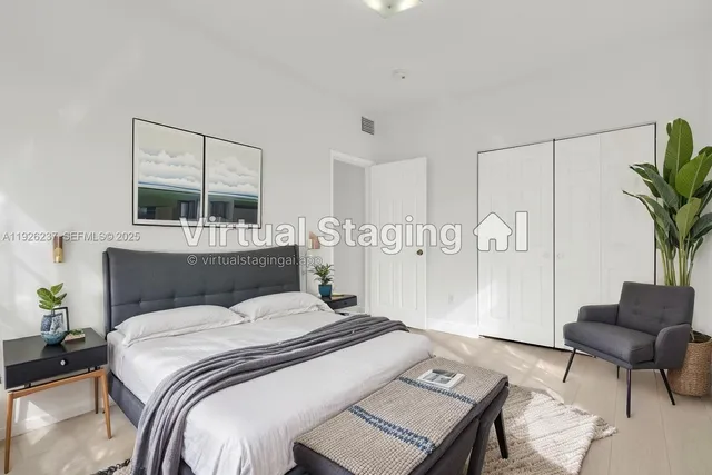 a bed room with a bed window and a chair