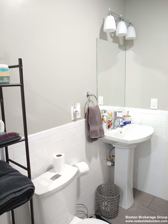 17 Ashley Street, Unit 2 Boston, MA 02130 - Photo 4 of 5 a bathroom with a sink and a mirror