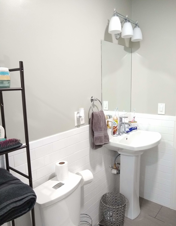 17 Ashley Street, Unit 2 Boston, MA 02130 - Photo 4 of 5 a bathroom with a sink a toilet and mirror