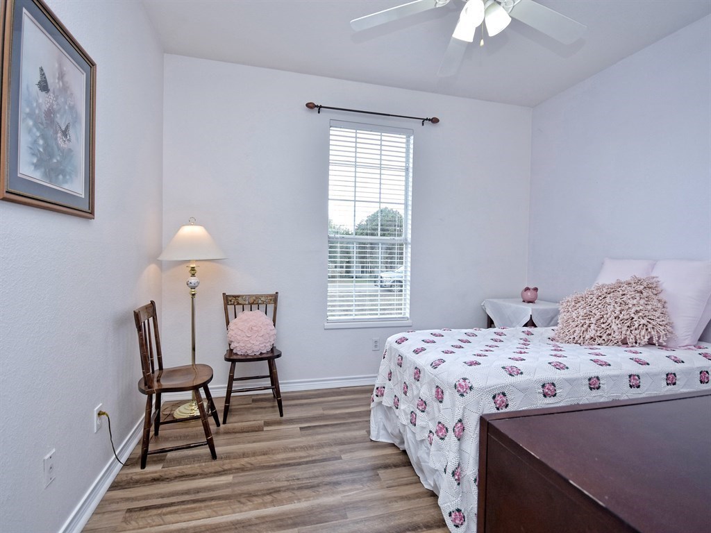600 Grand Prairie Circle Dripping Springs, TX 78620 - Photo 15 of 25 a bedroom with a bed and a table